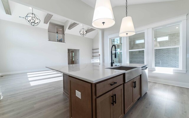 7295 NW Hwy, Fairview, TN 37062 - kitchen with a chandelier, a sink, light wood finished floors, light countertops, and baseboards