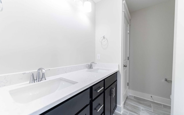 7295 NW Hwy, Fairview, TN 37062 - bathroom featuring double vanity, baseboards, and toilet