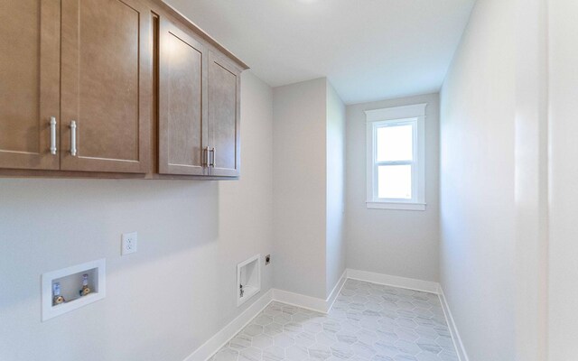 7295 NW Hwy, Fairview, TN 37062 - laundry room with cabinet space, hookup for a washing machine, hookup for an electric dryer, baseboards, and light tile patterned floors