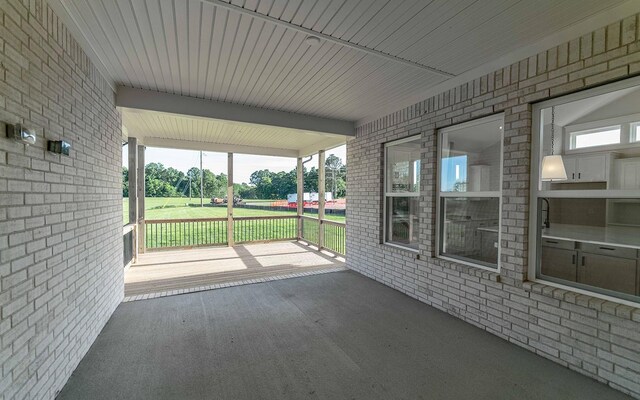 7295 NW Hwy, Fairview, TN 37062 - unfurnished sunroom featuring beam ceiling