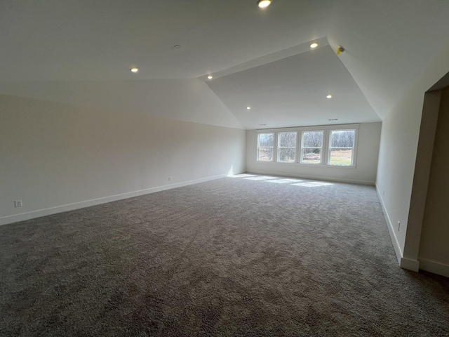 interior space with carpet, baseboards, lofted ceiling, and recessed lighting