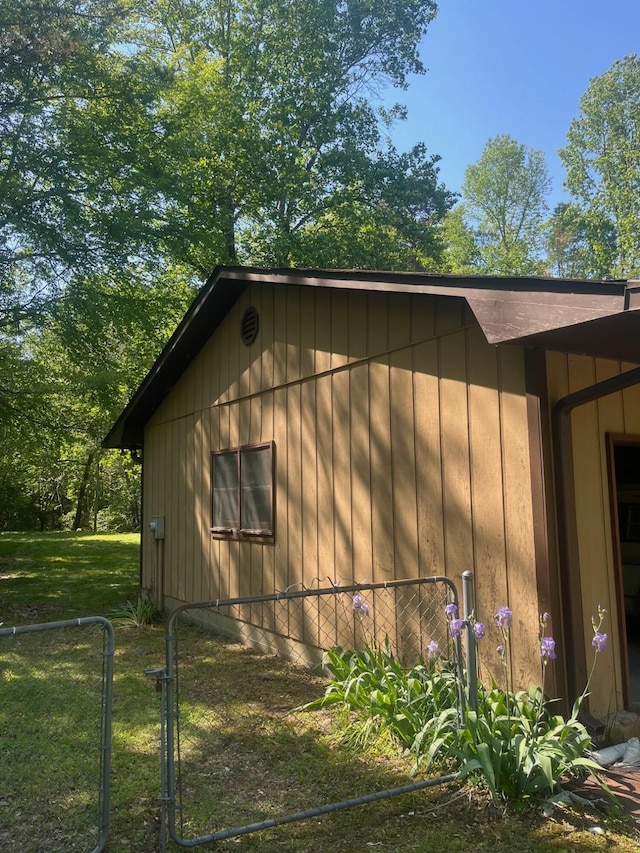 view of side of home with fence