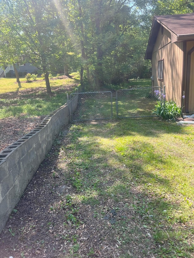 view of yard featuring a gate and fence