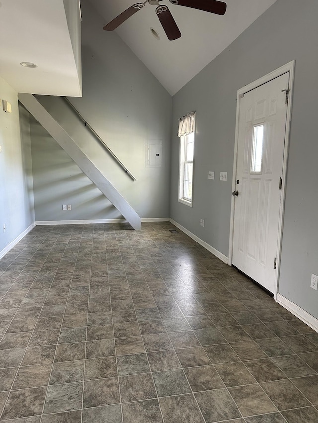 entryway featuring vaulted ceiling, baseboards, and ceiling fan