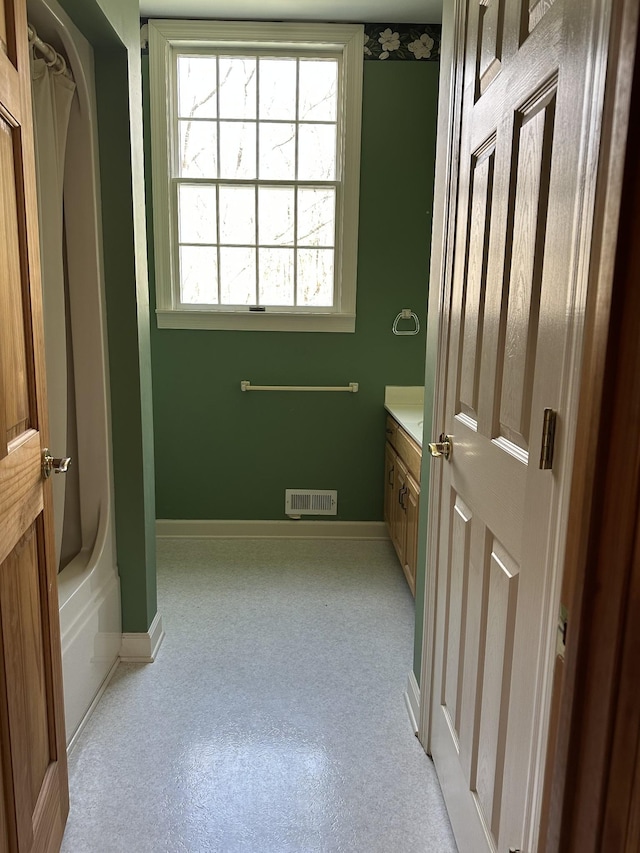 full bath with carpet flooring, baseboards, vanity, and visible vents