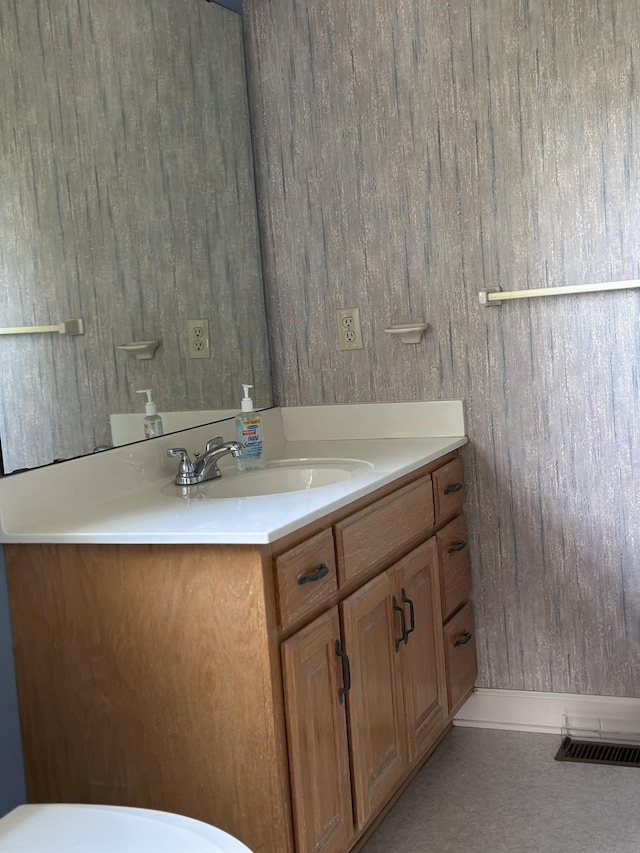bathroom with visible vents and vanity