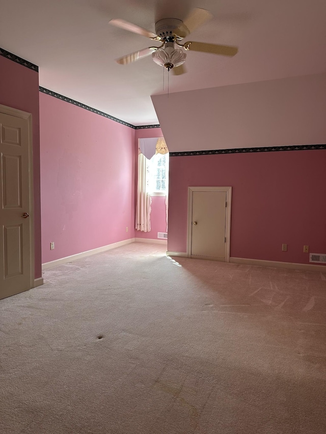 bonus room with carpet, visible vents, baseboards, and ceiling fan
