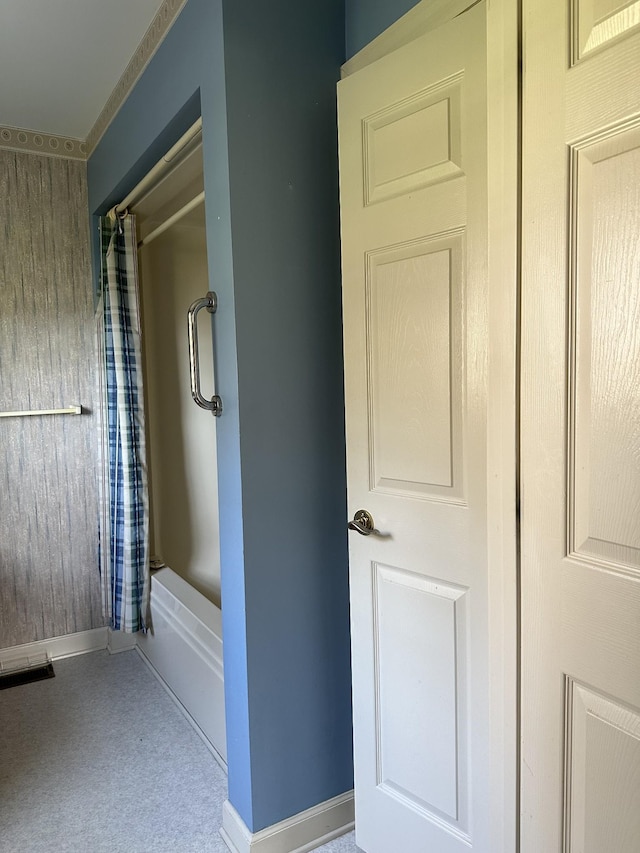 full bath with baseboards