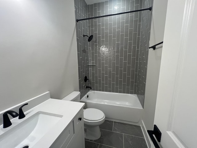 bathroom with marble finish floor, toilet, vanity, and shower / bathing tub combination