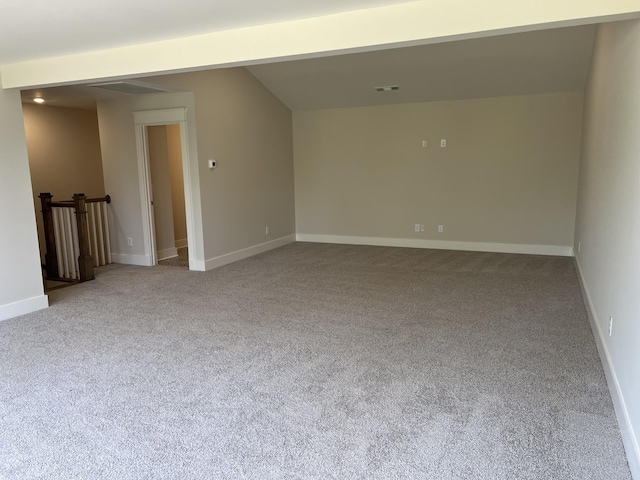 carpeted empty room with baseboards