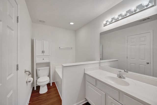 1131 Nashboro Blvd, Nashville, TN 37217 - full bath with toilet, vanity, wood finished floors, and visible vents