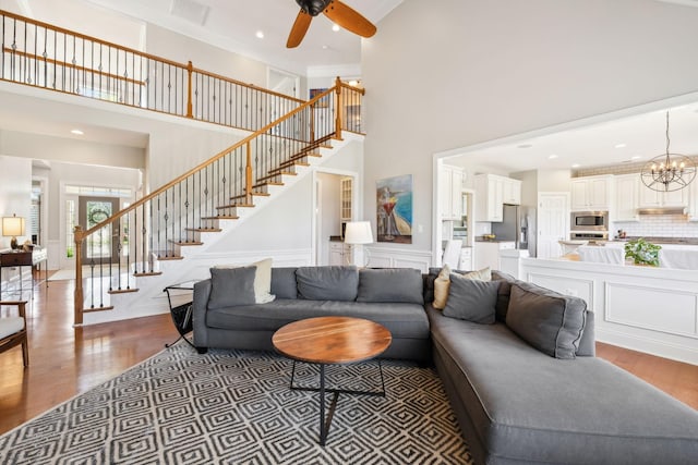 107 Jasmine Ct, Gallatin, TN 37066 - living room with a high ceiling, stairs, wood finished floors, ceiling fan, and recessed lighting