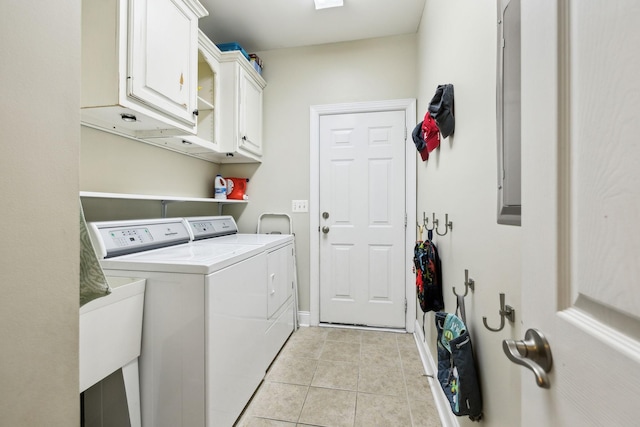 107 Jasmine Ct, Gallatin, TN 37066 - washroom with separate washer and dryer, light tile patterned floors, and cabinet space