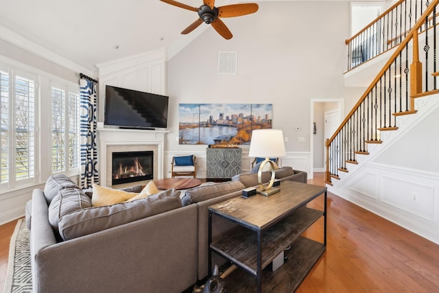 107 Jasmine Ct, Gallatin, TN 37066 - living area with ceiling fan, a high end fireplace, healthy amount of natural light, wood finished floors, and a decorative wall