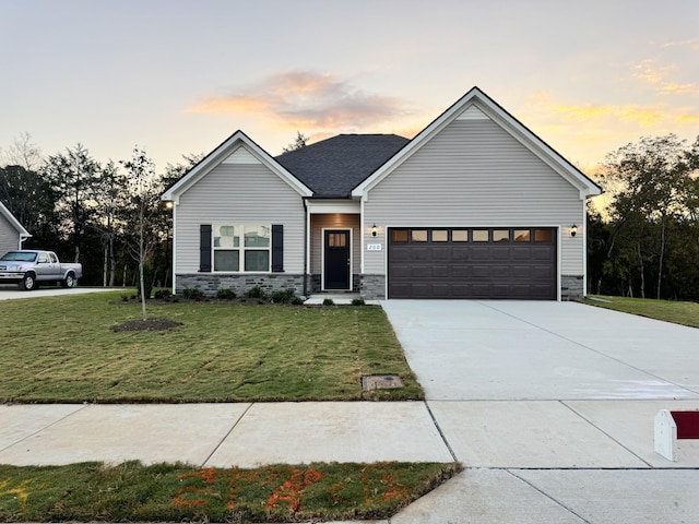 604 Rabbit Branch Rd, Shelbyville, TN 37160 - view of front of house featuring stone siding, an attached garage, a yard, and concrete driveway