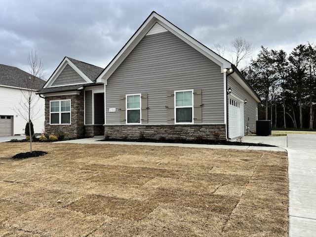 604 Rabbit Branch Rd, Shelbyville, TN 37160 - craftsman-style home featuring stone siding, a garage, and concrete driveway