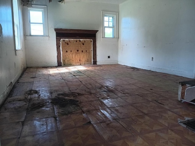 unfurnished living room with a wealth of natural light