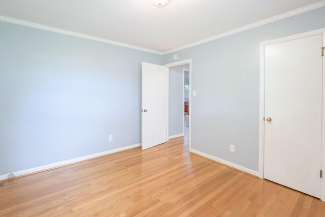107 Hillis St, Mcminnville, TN 37110 - unfurnished bedroom featuring light wood finished floors, crown molding, and baseboards