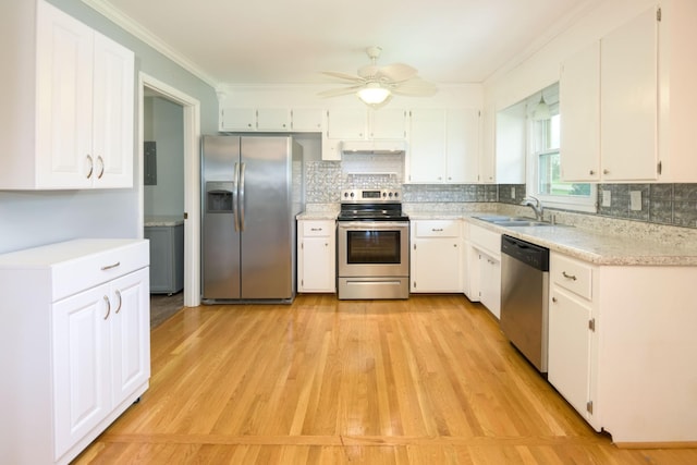 107 Hillis St, Mcminnville, TN 37110 - kitchen featuring stainless steel appliances, light countertops, a ceiling fan, ornamental molding, and a sink