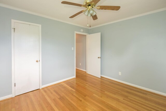 107 Hillis St, Mcminnville, TN 37110 - unfurnished bedroom featuring light wood finished floors, crown molding, baseboards, and ceiling fan