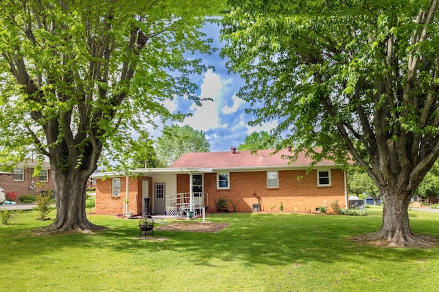 107 Hillis St, Mcminnville, TN 37110 - back of house with brick siding and a yard