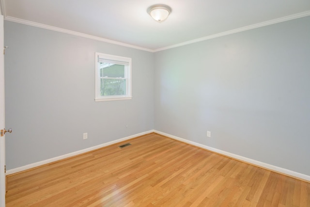 107 Hillis St, Mcminnville, TN 37110 - unfurnished room featuring light wood-style flooring, visible vents, baseboards, and ornamental molding