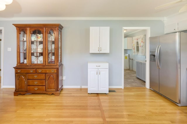 107 Hillis St, Mcminnville, TN 37110 - interior space featuring light wood finished floors, baseboards, ceiling fan, and crown molding