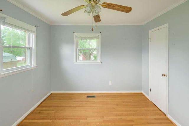 107 Hillis St, Mcminnville, TN 37110 - empty room with ornamental molding, a healthy amount of sunlight, and light wood-style floors