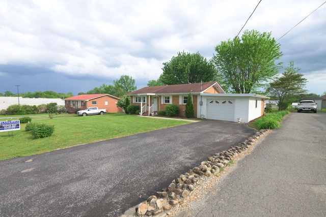107 Hillis St, Mcminnville, TN 37110 - ranch-style house with a garage, driveway, and a front lawn