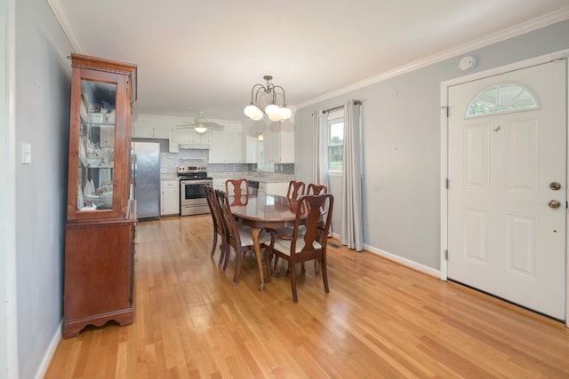 107 Hillis St, Mcminnville, TN 37110 - dining area with ceiling fan with notable chandelier, baseboards, light wood-style floors, and crown molding