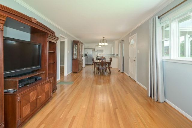 107 Hillis St, Mcminnville, TN 37110 - dining room with light wood-style floors, ornamental molding, baseboards, and a notable chandelier