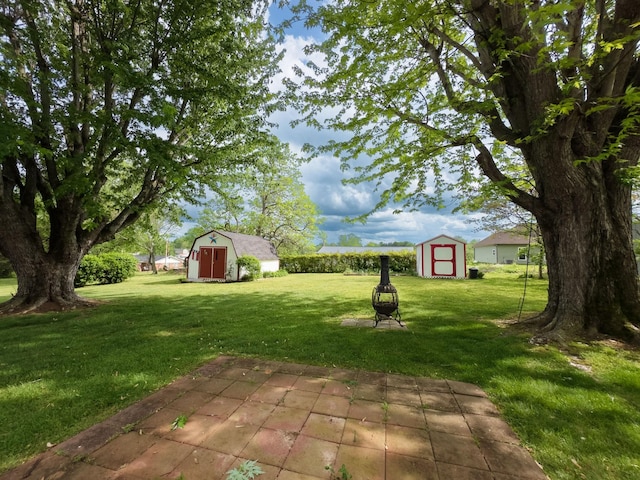 107 Hillis St, Mcminnville, TN 37110 - view of yard with a storage shed, an outbuilding, and a patio