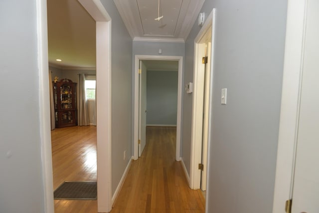 107 Hillis St, Mcminnville, TN 37110 - corridor with attic access, crown molding, light wood-style flooring, and baseboards
