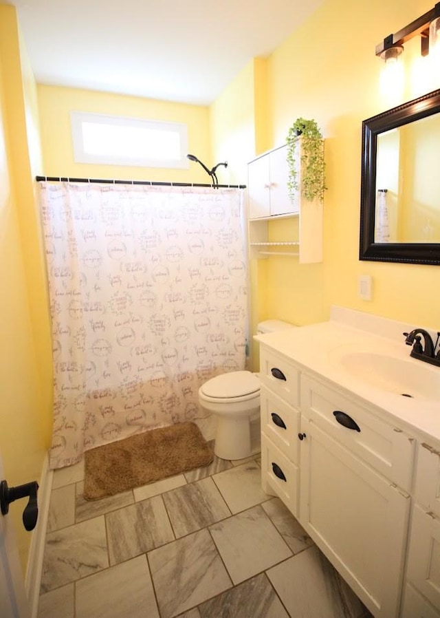 full bathroom featuring vanity, marble finish floor, a shower with shower curtain, and toilet
