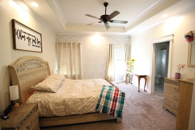 carpeted bedroom featuring connected bathroom, ceiling fan, a raised ceiling, ornamental molding, and recessed lighting