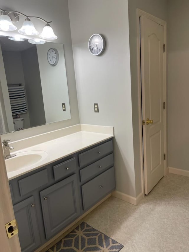 bathroom featuring vanity and baseboards