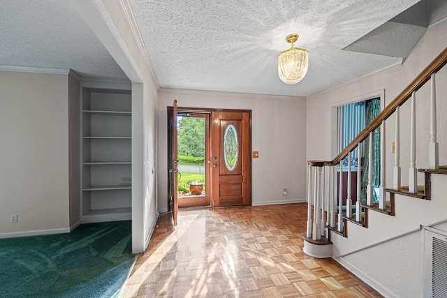 5712 Spring House Way, Brentwood, TN 37027 - foyer entrance featuring baseboards, a chandelier, stairway, a textured ceiling, and ornamental molding