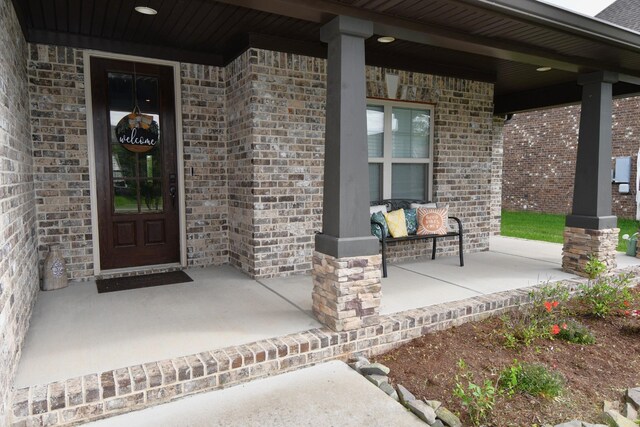 146 Neecee Dr, Smyrna, TN 37167 - entrance to property with a porch and brick siding