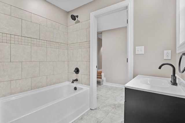 full bathroom with baseboards, tile patterned flooring, vanity, and bathtub / shower combination
