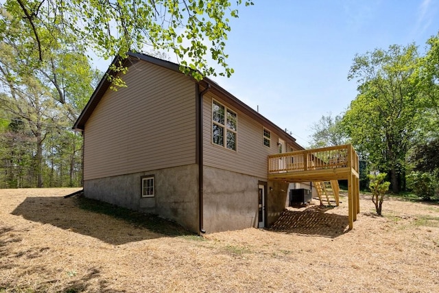 view of side of property with a deck