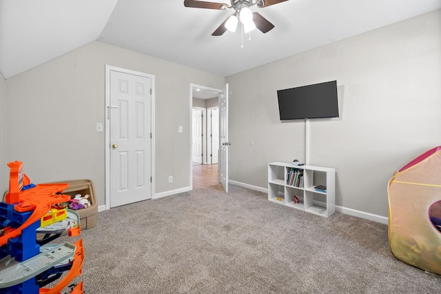 game room with vaulted ceiling, baseboards, carpet, and a ceiling fan