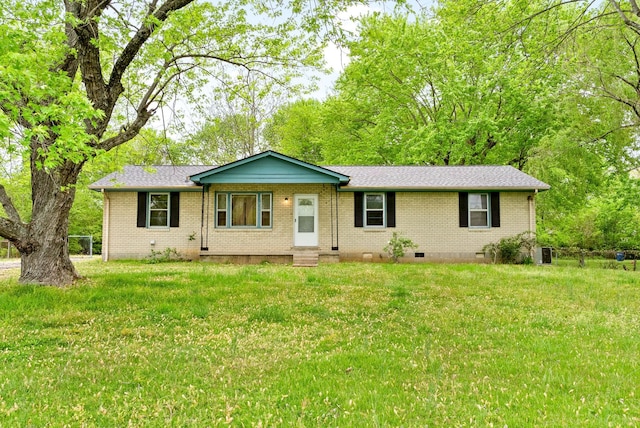 ranch-style home with a front yard, brick siding, and crawl space