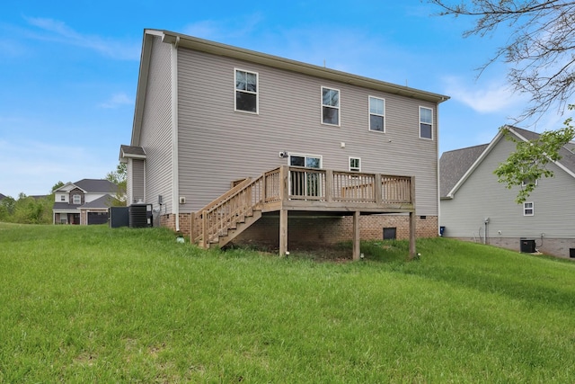 rear view of property with a wooden deck, stairs, a yard, and central AC