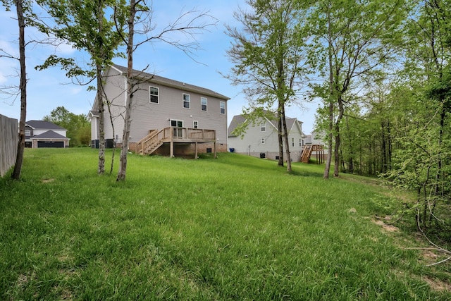 back of property with a wooden deck, crawl space, a yard, and stairs