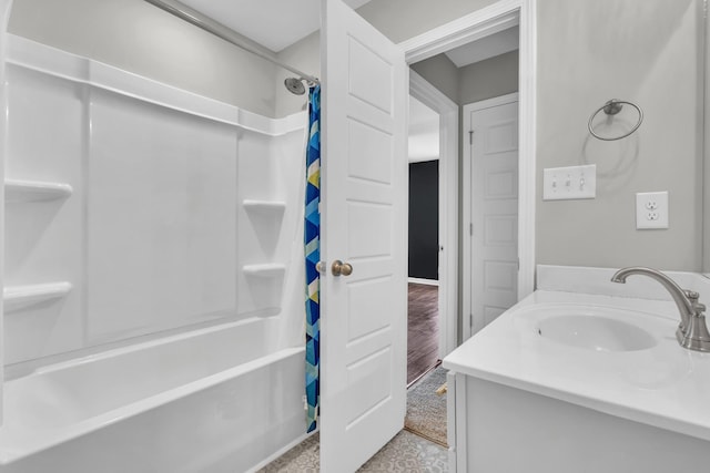 bathroom featuring vanity and shower / bathtub combination with curtain