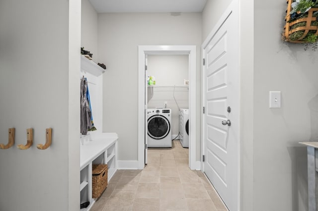 1239 Proprietors Pl, Murfreesboro, TN 37128 - washroom with washer and dryer, baseboards, laundry area, and light tile patterned floors