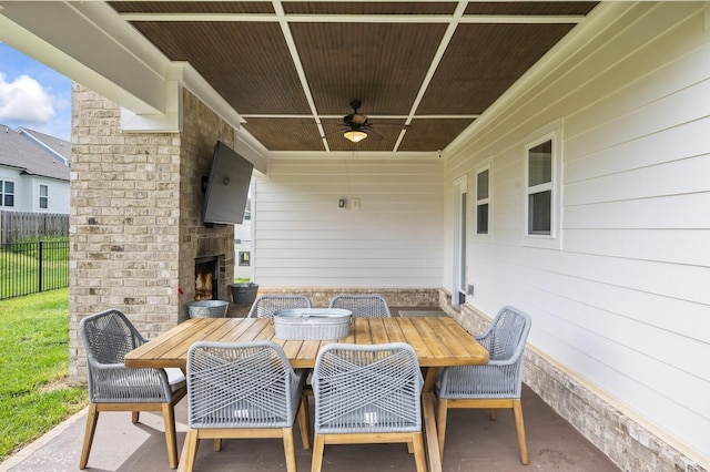 1239 Proprietors Pl, Murfreesboro, TN 37128 - view of patio / terrace with an outdoor brick fireplace, outdoor dining area, ceiling fan, and fence