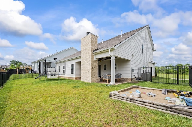 1239 Proprietors Pl, Murfreesboro, TN 37128 - rear view of property with a fenced backyard, a chimney, a patio area, a lawn, and a ceiling fan