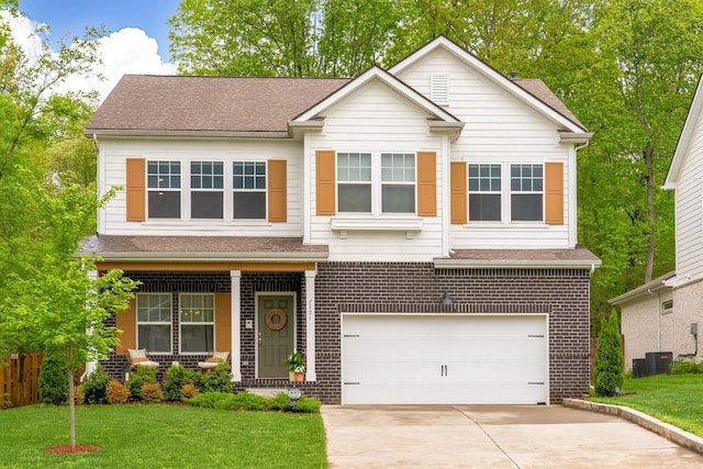 view of front facade featuring driveway, brick siding, an attached garage, a porch, and a front lawn