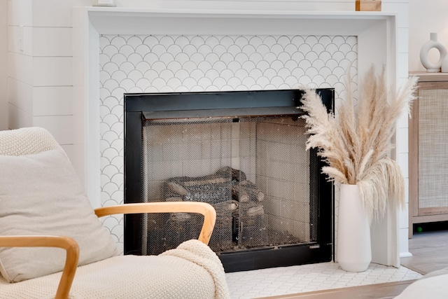 room details featuring a tile fireplace